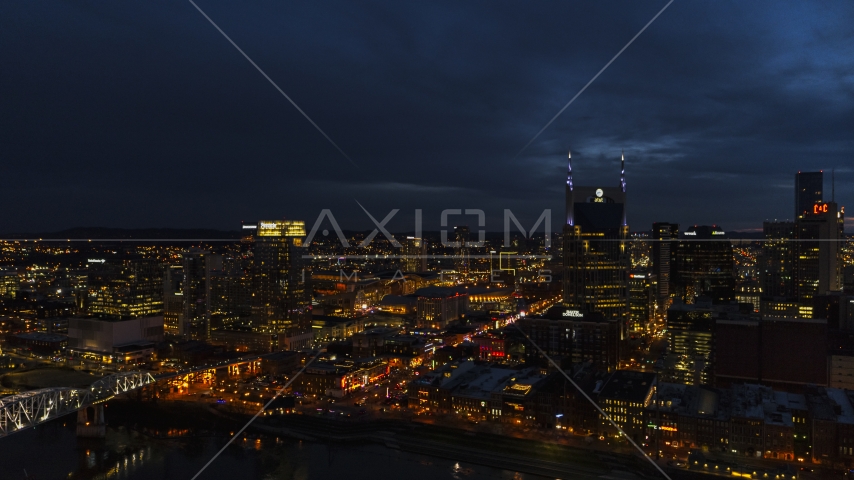 The Pinnacle skyscraper and AT&T Building flanking Broadway at twilight, Downtown Nashville, Tennessee Aerial Stock Photo DXP002_121_0008 | Axiom Images