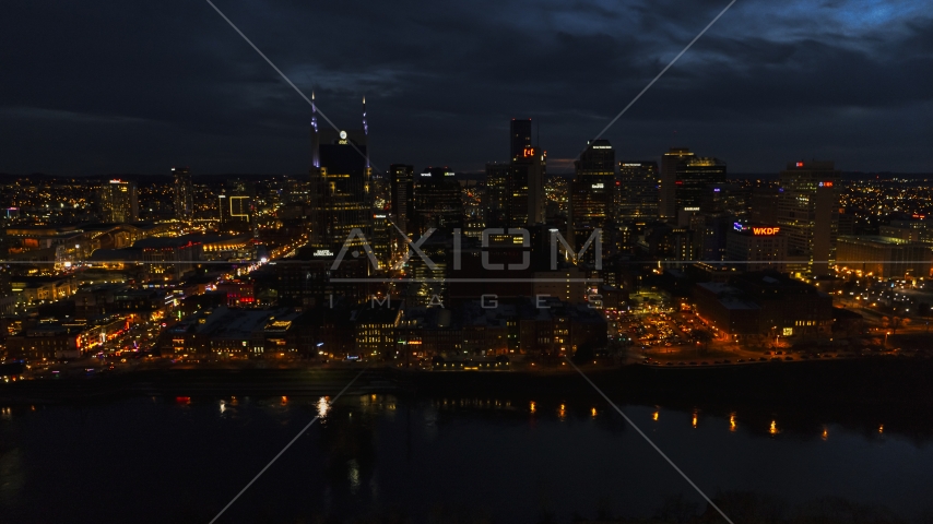 The city skyline and the AT&T Building across the river at twilight, Downtown Nashville, Tennessee Aerial Stock Photo DXP002_121_0010 | Axiom Images