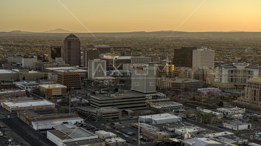 A view of high-rise office buildings at sunset, Downtown Albuquerque, New Mexico Aerial Stock Photo DXP002_122_0008 | Axiom Images