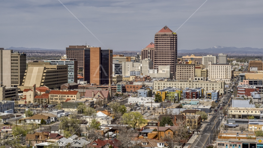 A view of Albuquerque Plaza office high-rise and surrounding buildings, Downtown Albuquerque, New Mexico Aerial Stock Photo DXP002_124_0010 | Axiom Images