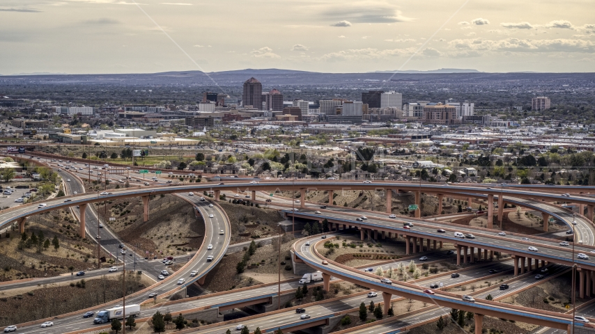 Downtown Albuquerque seen from freeway interchange traffic, New Mexico Aerial Stock Photo DXP002_126_0003 | Axiom Images
