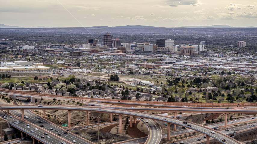 Downtown Albuquerque high-rises seen from a freeway interchange, New Mexico Aerial Stock Photo DXP002_126_0004 | Axiom Images