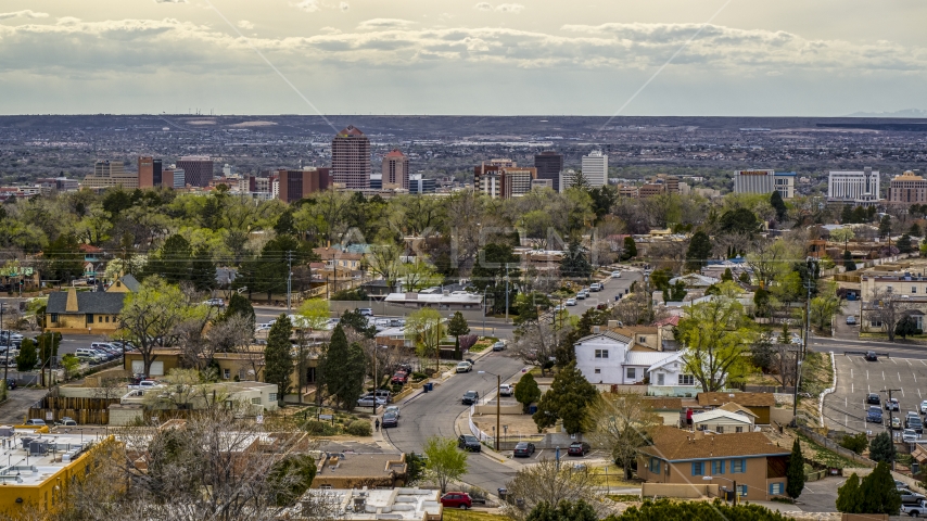 A wide view of city's high-rises seen from houses, Downtown Albuquerque, New Mexico Aerial Stock Photo DXP002_126_0006 | Axiom Images