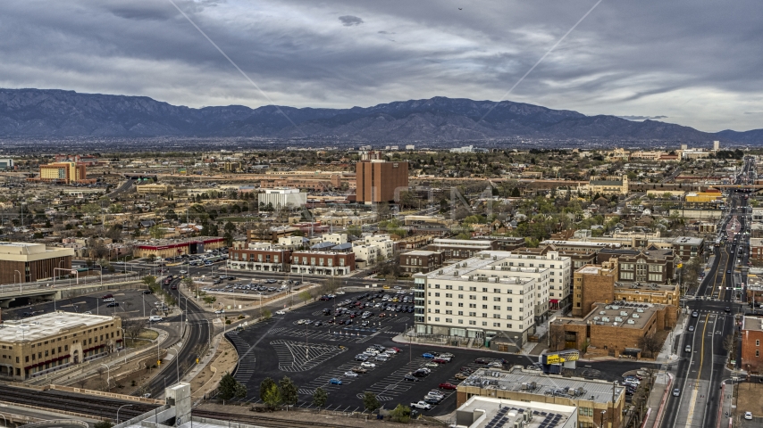 A wide view of office and apartment buildings, Downtown Albuquerque, New Mexico Aerial Stock Photo DXP002_127_0006 | Axiom Images