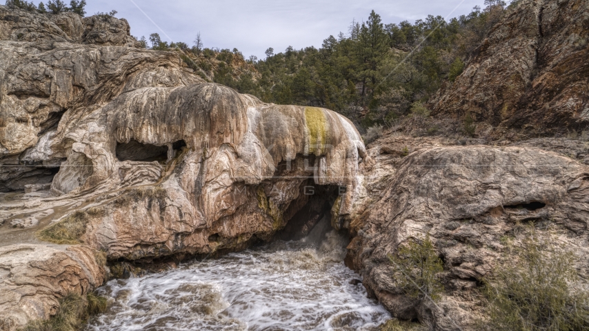 A close-up view of river rapids flowing through a rock formation in the mountains in New Mexico Aerial Stock Photo DXP002_129_0003 | Axiom Images