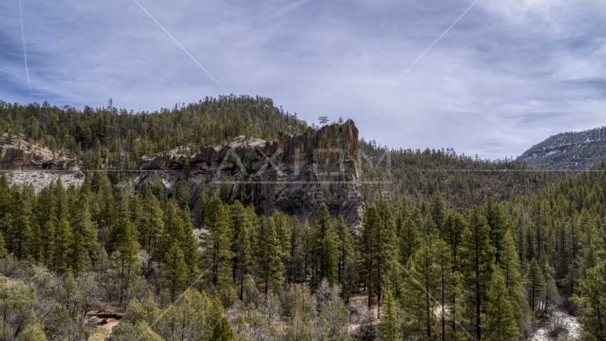 A rock formation in the mountains in New Mexico Aerial Stock Photo DXP002_129_0006 | Axiom Images
