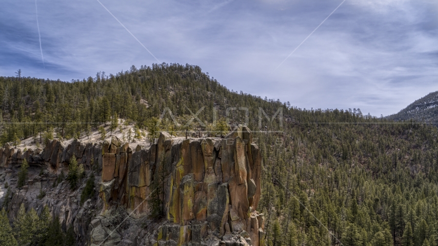 A close-up of a rock formation in the mountains in New Mexico Aerial Stock Photo DXP002_129_0008 | Axiom Images