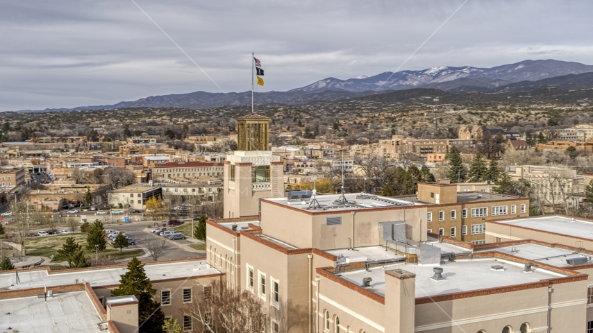 The tower and flags on Bataan Memorial Building, Santa Fe, New Mexico Aerial Stock Photo DXP002_131_0008 | Axiom Images