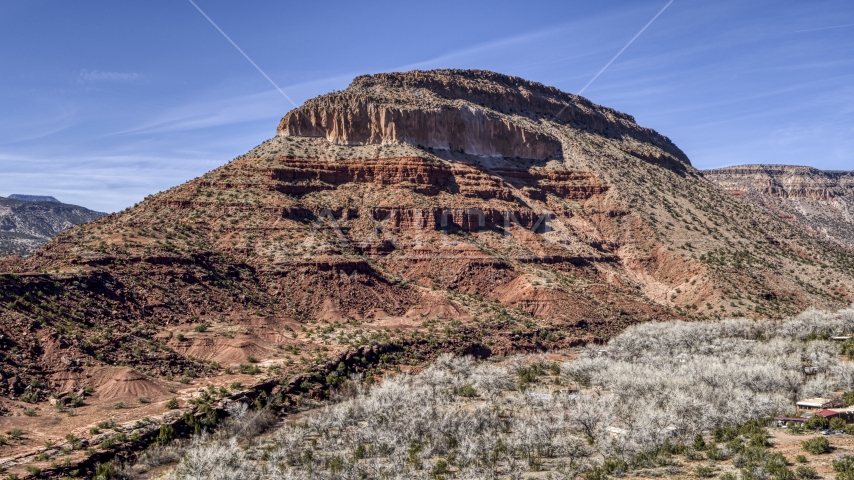 A tall, rocky butte in New Mexico Aerial Stock Photo DXP002_135_0002 | Axiom Images