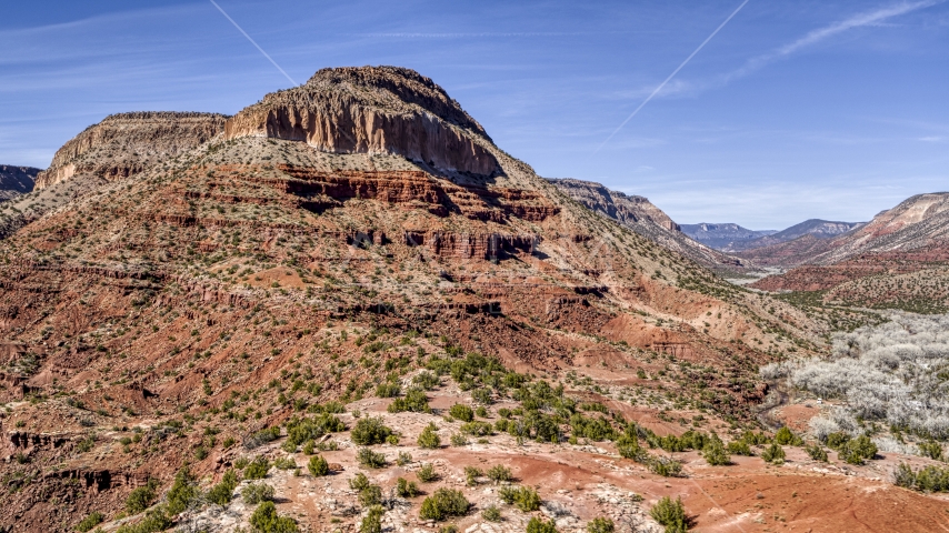 The side of a large butte with steep slopes, New Mexico Aerial Stock Photo DXP002_135_0004 | Axiom Images