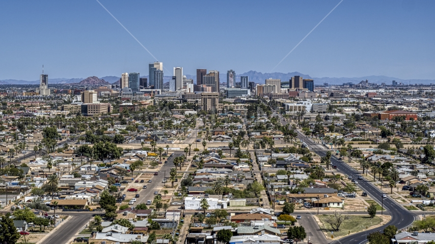 A view of the city's distant skyline, Downtown Phoenix, Arizona Aerial Stock Photo DXP002_136_0010 | Axiom Images