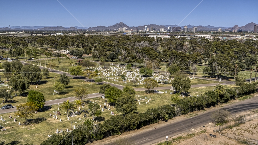 Green lawns, trees and grave markers at a cemetery in Phoenix, Arizona Aerial Stock Photo DXP002_137_0001 | Axiom Images