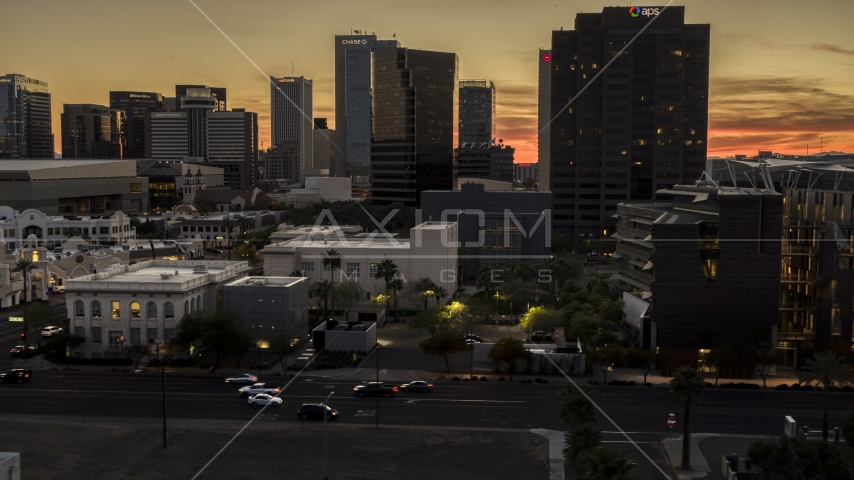 A view of tall office high-rises at sunset in Downtown Phoenix, Arizona Aerial Stock Photo DXP002_139_0002 | Axiom Images
