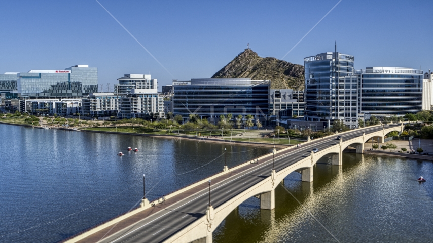 Modern office buildings near a bridge over a reservoir in Tempe, Arizona Aerial Stock Photo DXP002_142_0006 | Axiom Images