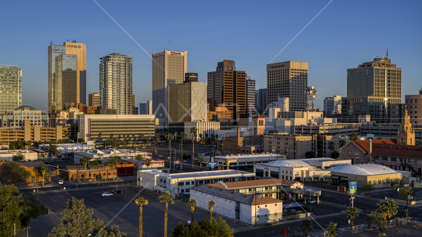 Tall buildings in the city's skyline of Downtown Phoenix, Arizona, sunset Aerial Stock Photo DXP002_143_0005 | Axiom Images