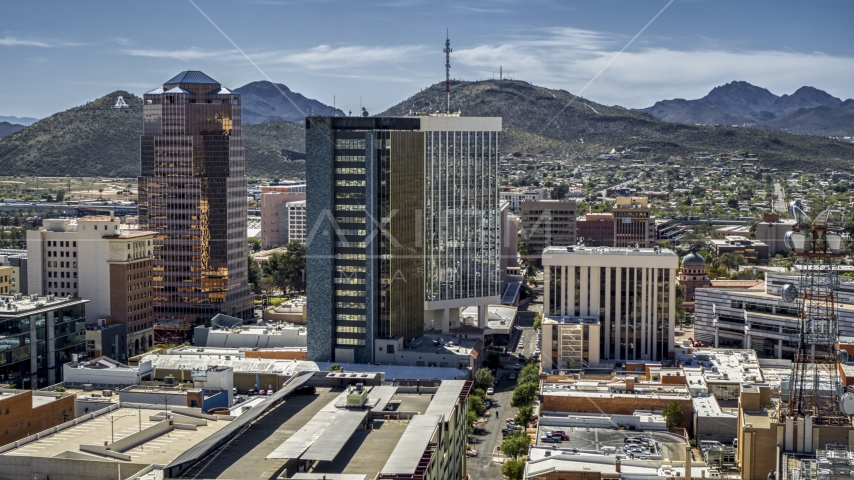Three office towers with Sentinel Peak behind them, Downtown Tucson, Arizona Aerial Stock Photo DXP002_144_0005 | Axiom Images