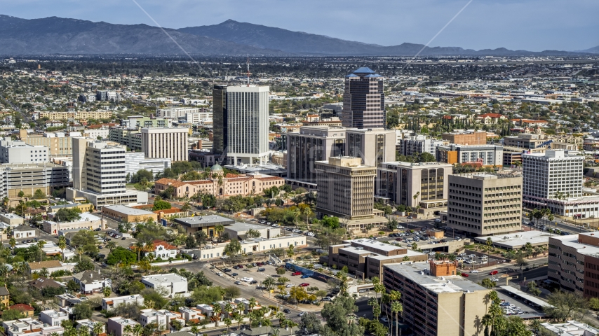 A view of tall high-rise office towers and city buildings in Downtown Tucson, Arizona Aerial Stock Photo DXP002_144_0007 | Axiom Images