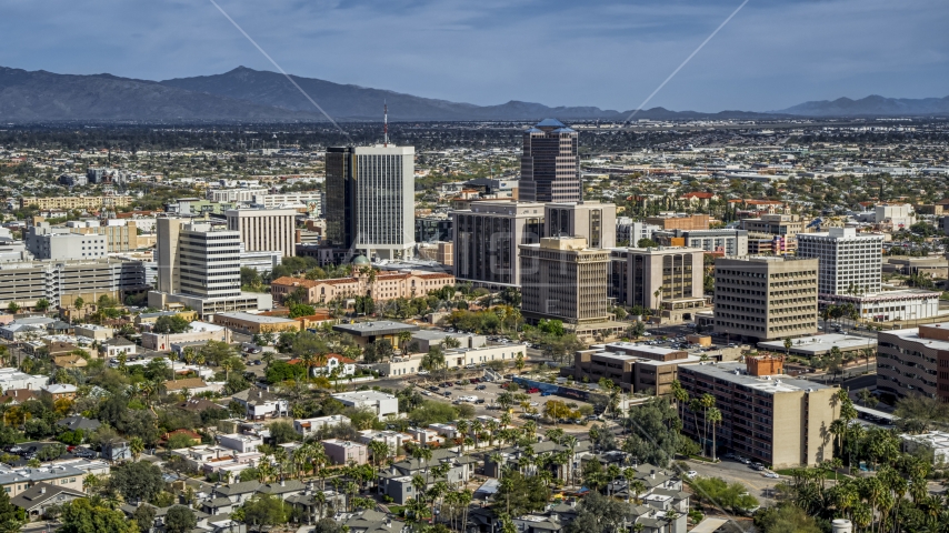 A pair of tall high-rise office towers and city buildings in Downtown Tucson, Arizona Aerial Stock Photo DXP002_144_0009 | Axiom Images