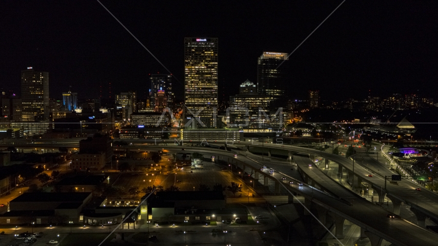 A view of downtown buildings and skyscrapers at night, Downtown Milwaukee, Wisconsin Aerial Stock Photo DXP002_151_0004 | Axiom Images