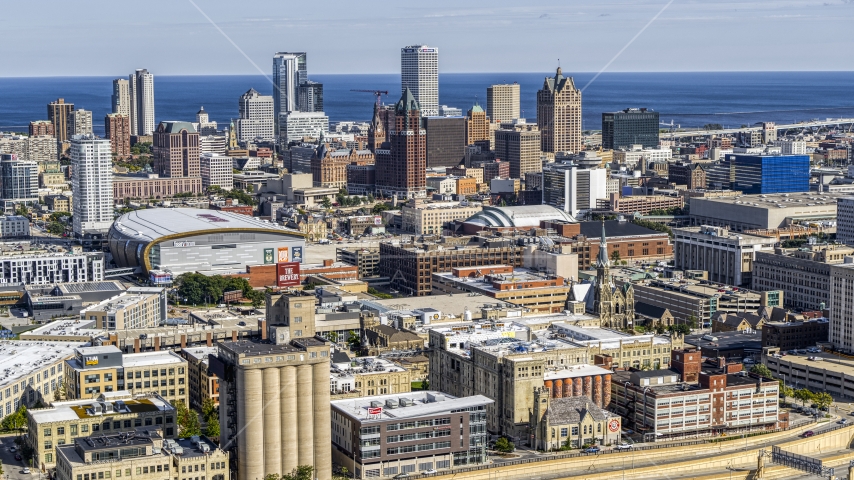 The city's skyline and arena in Downtown Milwaukee, Wisconsin, seen from industrial buildings Aerial Stock Photo DXP002_152_0003 | Axiom Images