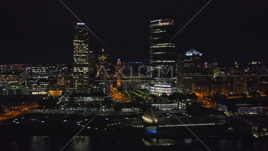The lakefront museum and skyscrapers at night, Downtown Milwaukee, Wisconsin Aerial Stock Photo DXP002_157_0005 | Axiom Images
