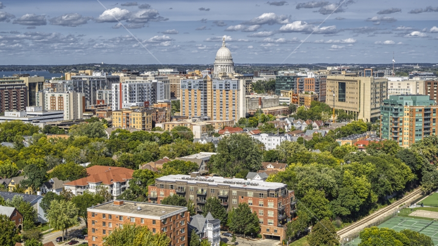 A view of apartment buildings near the capitol dome in Madison, Wisconsin Aerial Stock Photo DXP002_158_0002 | Axiom Images