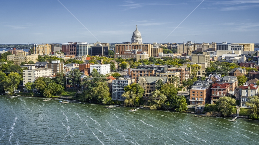 The capitol dome seen from lakeside apartment buildings in Madison, Wisconsin Aerial Stock Photo DXP002_160_0003 | Axiom Images