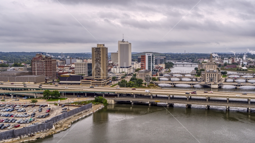 An apartment high-rise and office buildings near bridges over the river, Downtown Cedar Rapids, Iowa Aerial Stock Photo DXP002_164_0001 | Axiom Images