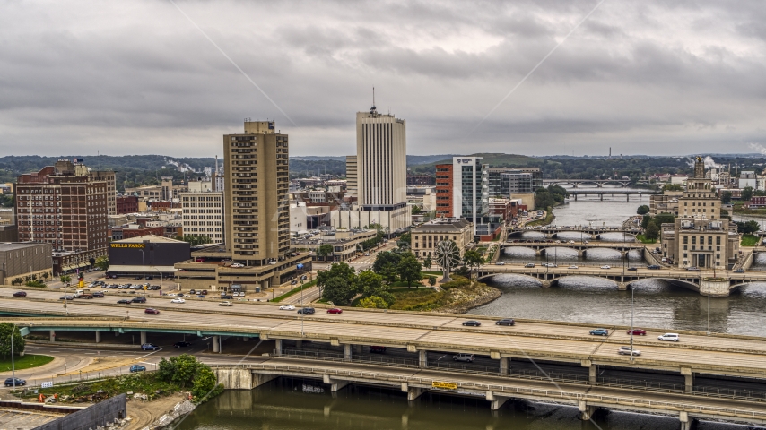 An apartment high-rise and office buildings near bridges and river, Downtown Cedar Rapids, Iowa Aerial Stock Photo DXP002_164_0002 | Axiom Images