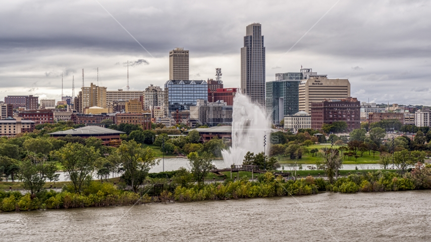 A fountain and riverfront park with view of skyline, Downtown Omaha, Nebraska Aerial Stock Photo DXP002_169_0006 | Axiom Images
