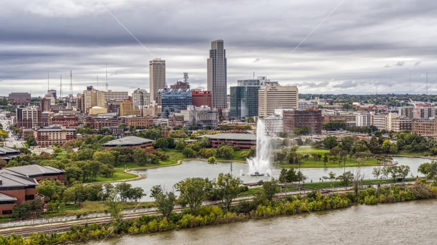 The city's skyline while seen from near a park fountain, Downtown Omaha, Nebraska Aerial Stock Photo DXP002_169_0009 | Axiom Images