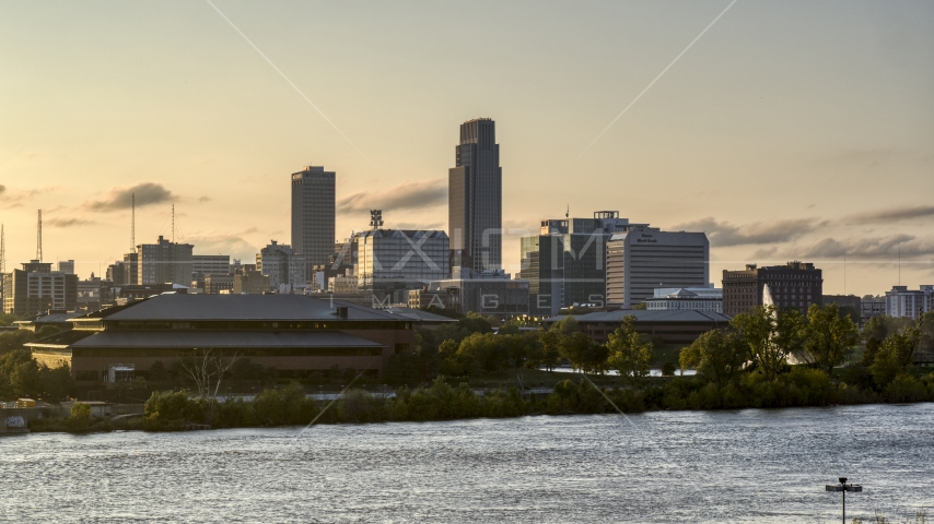 The skyline at sunset, seen from the river, Downtown Omaha, Nebraska Aerial Stock Photo DXP002_172_0006 | Axiom Images