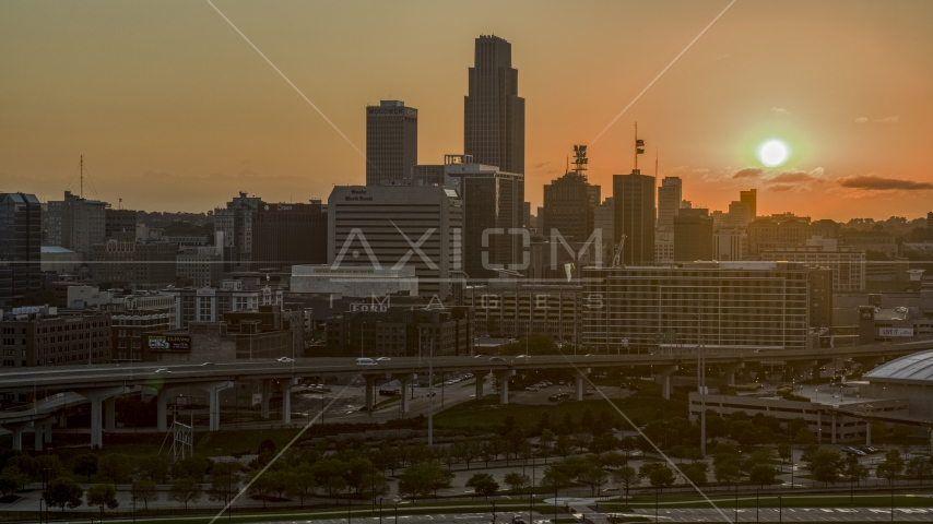 A skyscraper and skyline with view of setting sun, Downtown Omaha, Nebraska Aerial Stock Photo DXP002_172_0010 | Axiom Images