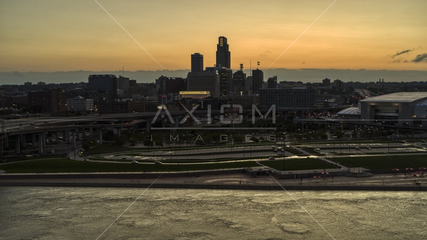 The skyline at sunset, seen from the Missouri River, Downtown Omaha, Nebraska Aerial Stock Photo DXP002_172_0013 | Axiom Images