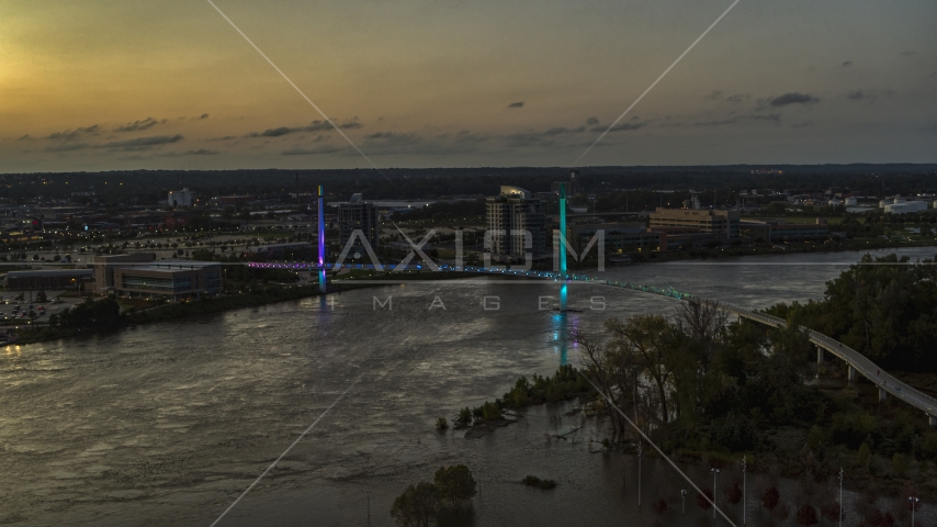 A pedestrian bridge spanning the Missouri River at twilight, Omaha, Nebraska Aerial Stock Photo DXP002_172_0016 | Axiom Images