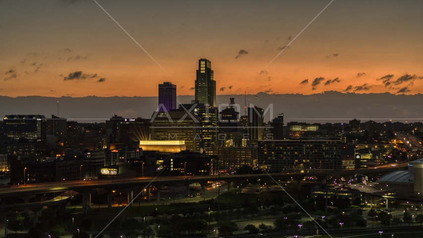 A view of skyscrapers in the skyline at twilight, Downtown Omaha, Nebraska Aerial Stock Photo DXP002_173_0003 | Axiom Images