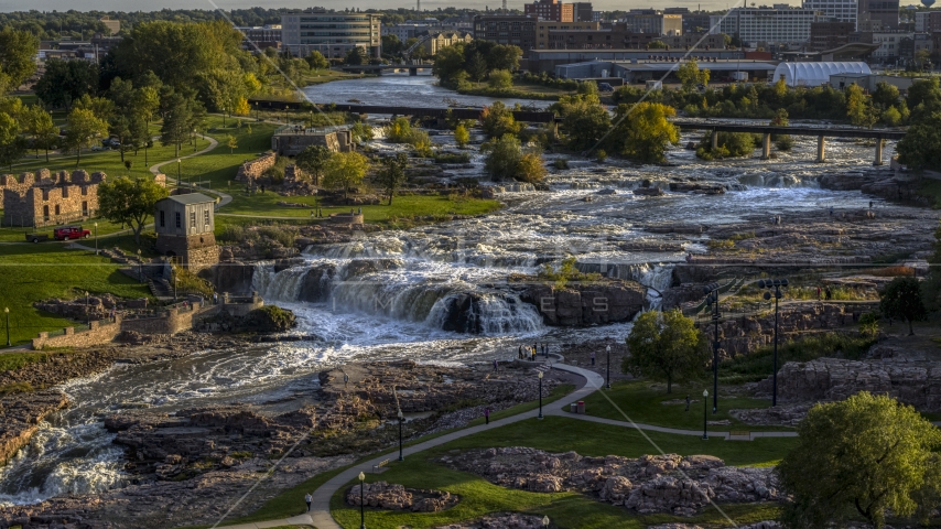 The waterfalls at Falls Park at sunset in Sioux Falls, South Dakota Aerial Stock Photo DXP002_176_0003 | Axiom Images