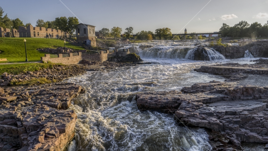 A view of waterfalls at sunset in Sioux Falls, South Dakota Aerial Stock Photo DXP002_176_0004 | Axiom Images
