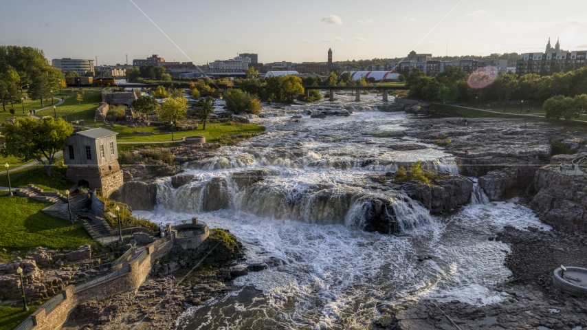 The waterfalls on Big Sioux River at sunset in Sioux Falls, South Dakota Aerial Stock Photo DXP002_176_0009 | Axiom Images