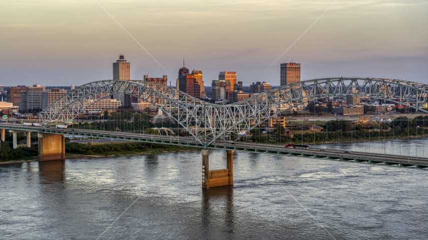 The city's skyline as traffic crosses the bridge at sunset, Downtown Memphis, Tennessee Aerial Stock Photo DXP002_181_0003 | Axiom Images