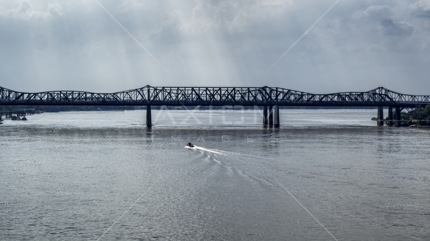 A boat speeding across the Mississippi River toward Harahan Bridge, Memphis, Tennessee Aerial Stock Photo DXP002_183_0006 | Axiom Images