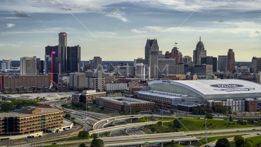The football stadium and the city skyline at sunset in Downtown Detroit, Michigan Aerial Stock Photo DXP002_191_0007 | Axiom Images
