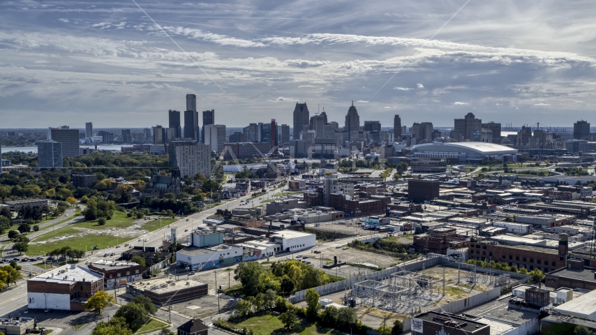 The city's skyline seen from brick industrial buildings, Downtown Detroit, Michigan Aerial Stock Photo DXP002_195_0001 | Axiom Images