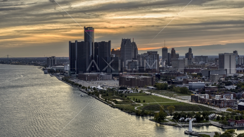 The GM Renaissance Center and the city's skyline seen from river at sunset, Downtown Detroit, Michigan Aerial Stock Photo DXP002_197_0005 | Axiom Images