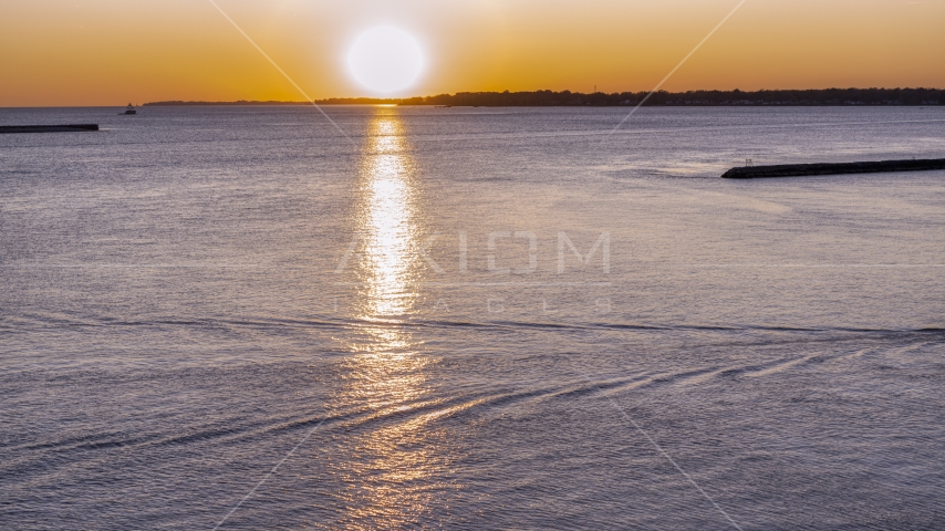 The setting sun over Lake Erie, Buffalo, New York Aerial Stock Photo DXP002_204_0006 | Axiom Images