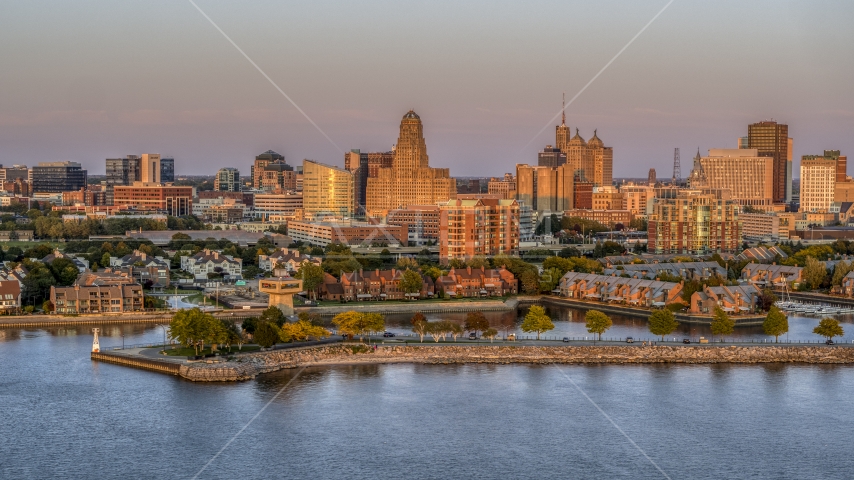 City hall and office buildings at sunset, seen from waterfront condos, Downtown Buffalo, New York Aerial Stock Photo DXP002_204_0012 | Axiom Images