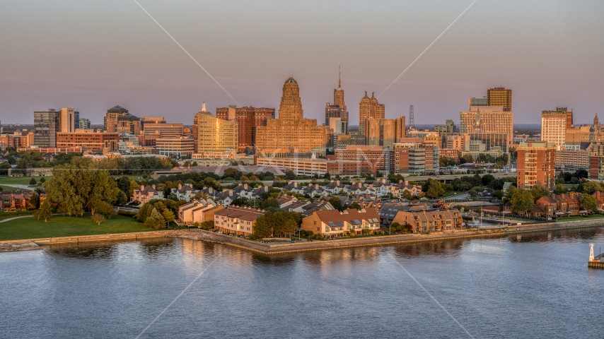 A view of city hall and office buildings at sunset, seen from waterfront condos, Downtown Buffalo, New York Aerial Stock Photo DXP002_204_0013 | Axiom Images