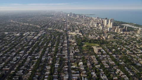 AX0001_057.0000341F - Aerial stock photo of Homes and apartment buildings in the North part of Chicago on a hazy day, Illinois