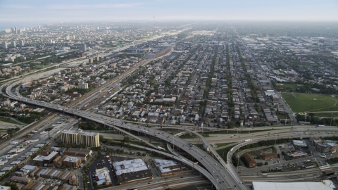 AX0001_075.0000122F - Aerial stock photo of The Interstate 90, 94, and 55 interchange and urban neighborhoods, South Chicago, Illinois