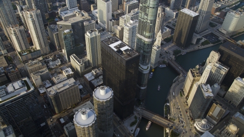 AX0001_084.0000110F - Aerial stock photo of A bird's eye of Marina City and Chicago River skyscrapers, Illinois
